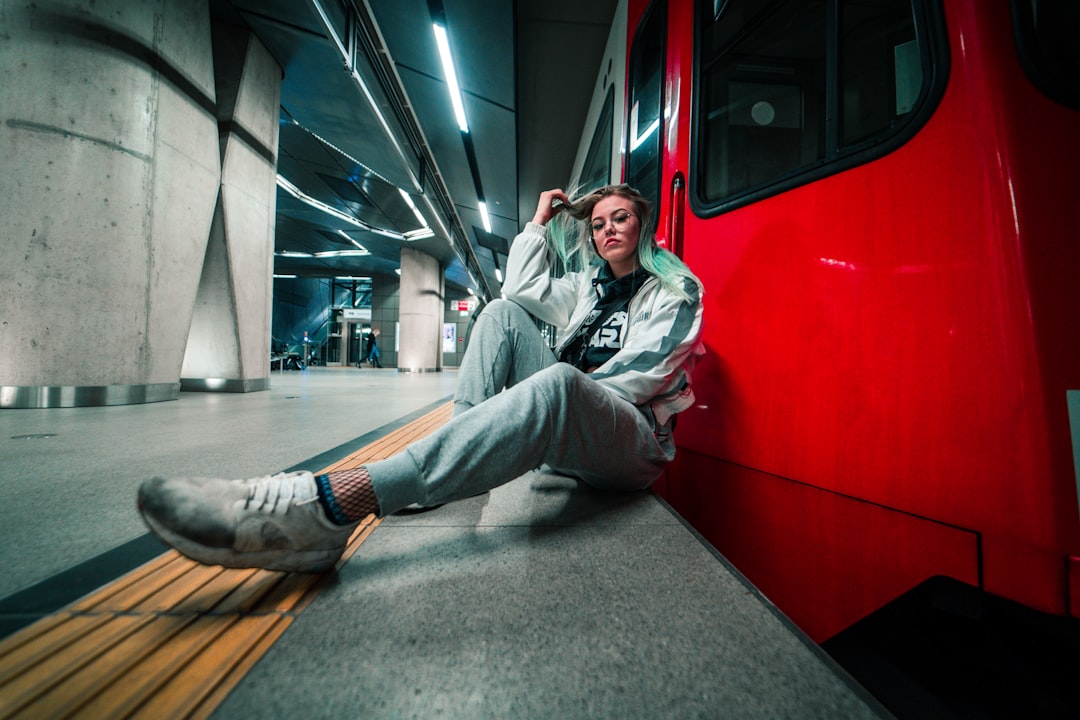woman-near-red-bus-s2vtw5dkito